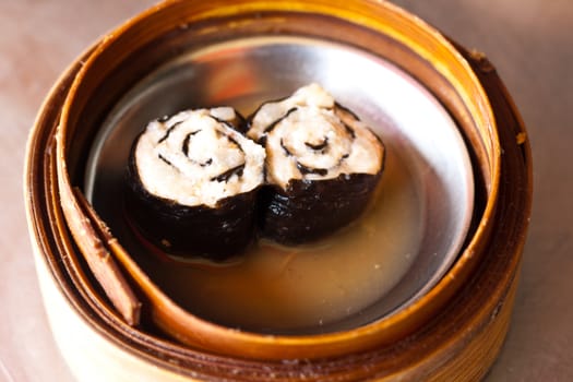 Dim Sum : Pork wrapped in seaweed, Steamed in a bamboo tray.