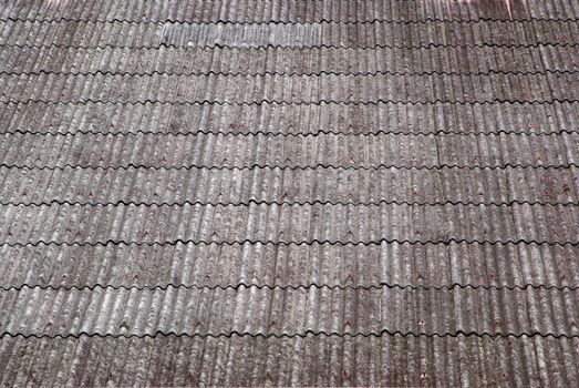 close up texture on corrugated asbestos roof of factory.