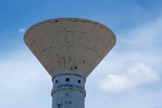 A View of Concrete Water Tower and Blue sky.