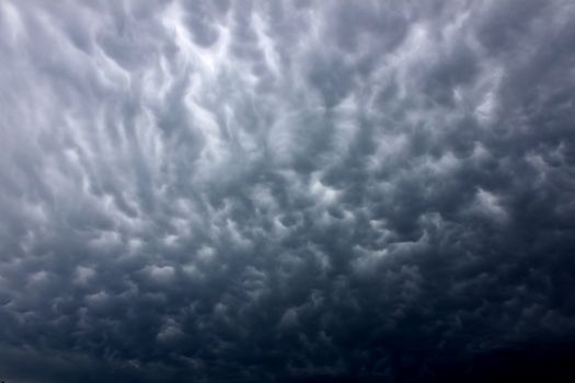 Ominous clouds precede the strong winds of a thunderstorm over Illinois.