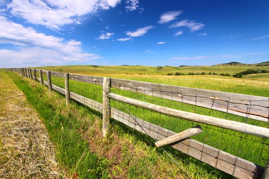 Wooden fenceline in the prairies of Custer State Park - South Dakota.