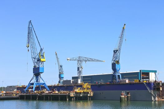 Industrial landscape. Cranes in shipyard