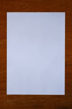 white paper on wood background