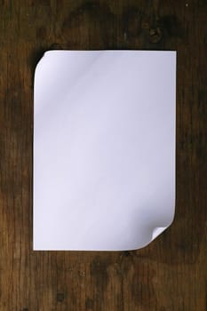 white paper on wood background