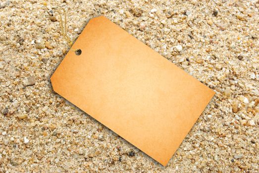 Sale Tag On Sand Texture