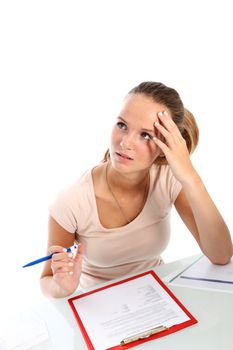 Beautiful young teenage college student writing a test seeks inspiration as she stares up into the heavens looking for an answer 
