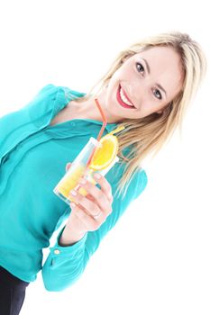 Beautiful blonde woman with a lovely beaming smile toasting her tropical vacation raising her glass of orange cocktail isolated on white Beautiful blonde womanwith a lovely beaming smile toasting her tropical vacation raising her glass of orange cocktail isolated on white