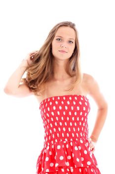 Attractive young woman posing in a modern trendy off the shoulder red and white colourful sundress isolated on white Attractive young woman posing in a modern trendy off the shoulder red and white colourful sundress isolated on white