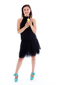 Beautiful woman smilling merrily standing in a trendy black party dress with a glass of cocktail in her hands isolated on white Beautiful woman smilling merrily standing in a trendy black party dress with a glass of cocktail in her hands isolated on white