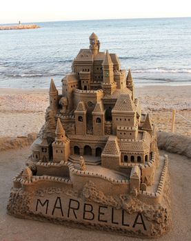 large sandcastle on the beach in spain