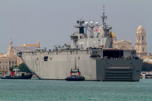 CADIZ, SPAIN-JUN 01: Aircraft carrier L-61 Juan Carlos I docking to take part in an exhibition on the day of the spanish army forces on Jun 01, 2012, in Cadiz, Spain