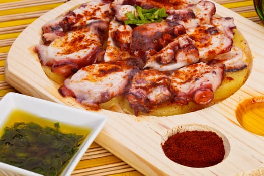Octopus with paprika, potatoes and olive oil typical of Galicia, Spain