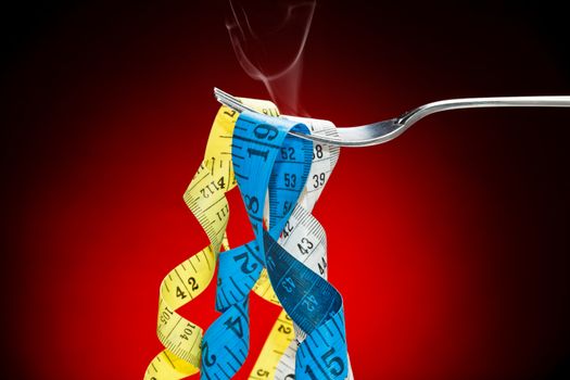Tape measure pretending to fetuccini in a fork