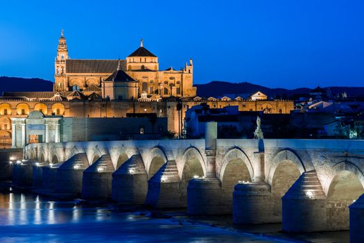 Cityscape of Cordoba at sunset with roman bridge and Mezquita, Andalusia, Spain