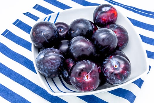 A plums dish on a white background
