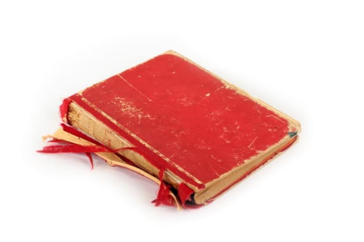 Isolated old torn red book against white background