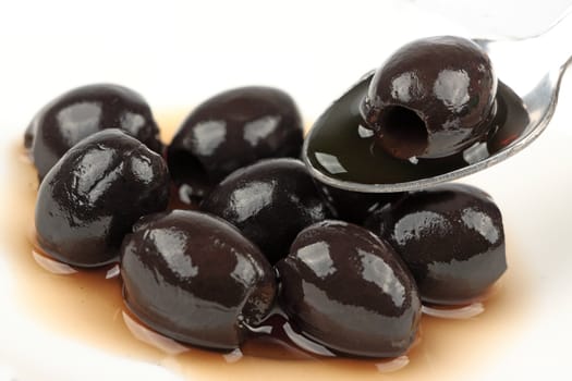 Black olives on white background