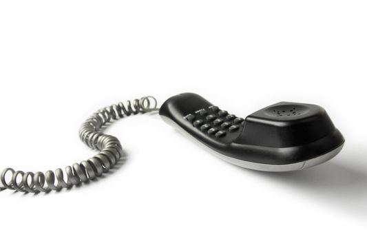 Wired telephone against white background