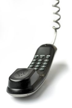 Wired telephone against white background