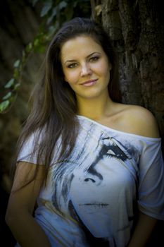 Beautiful young woman in the park on a sunny day