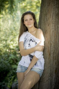 Young woman in the forest on a sunny day