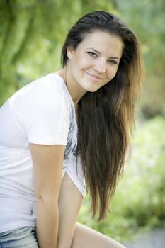 Young woman in the forest on a sunny day