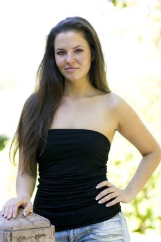 Beautiful young woman in the park on a sunny day