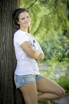 Young woman in the forest on a sunny day