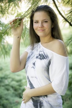 Young woman in the forest on a sunny day