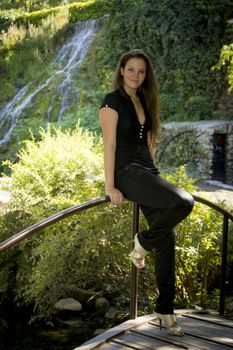 Beautiful young woman in the park on a sunny day