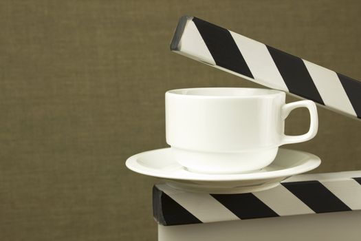 conceptual image of white cup on clapboard