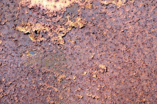 Background of rusty peeling paint steel wall texture. Time and corrosion affected surface.