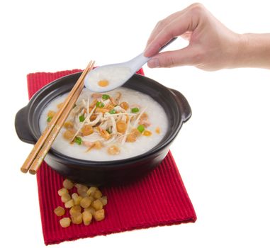 Porridge, scallop & chicken Porridge (congee) served in claypot