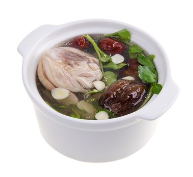 Chicken and herb soup in pot, Chinese food style.