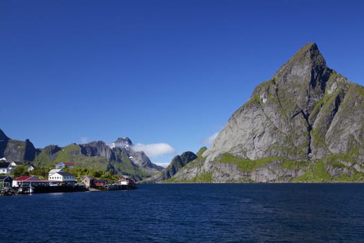 Picturesque panorama of mountain peaks around fjord on Lofoten islands in Norway