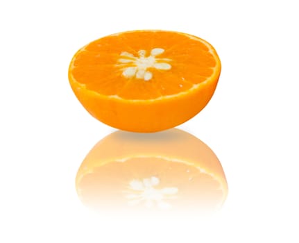 a half of orange fruits on white background with reflection