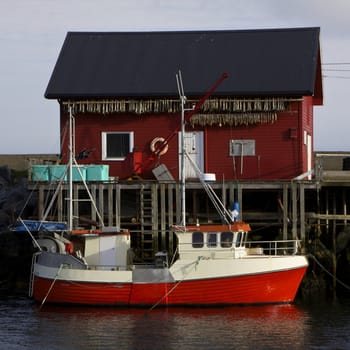 Norwegian fishing boat with fishing house on island of Vaeroy, Lofoten