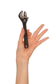 woman holding small chrome vanadium adjustable spanner in the hand