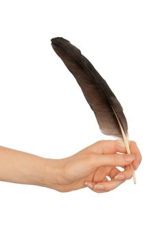 woman writing with a black feather on white background