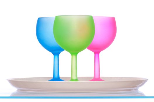 three colored wine glasses for cocktails on the tray for party