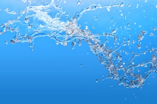 pouring tropical blue sea water in a glass aquarium
