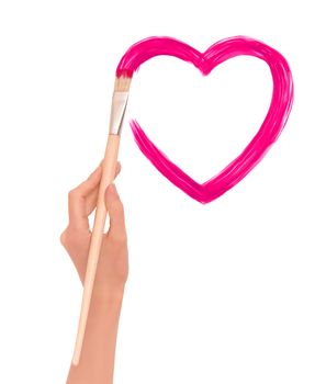 painter drawing pink heart on the wall as a symbol of love