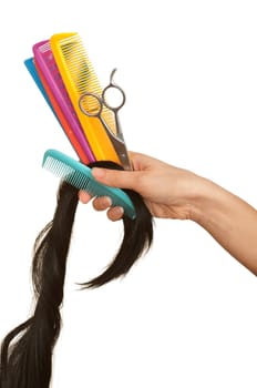 hairdresser cutting young woman with long black hair