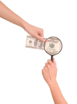 Woman magnifying 100 dollars with lens