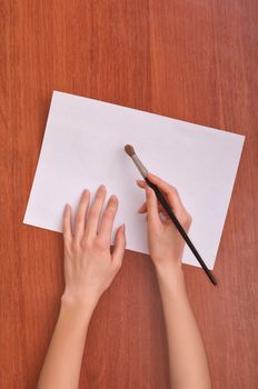 Woman drawing the paper at lesson