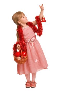 Little girl standing with basket with toys for christmas