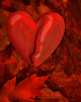 cracked heart in the pile of autumn leaves