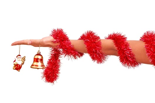 Christmas-tree bell in the hand on white background