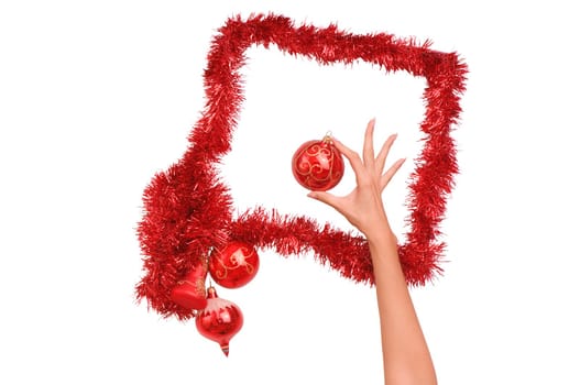 Frame decorated with Christmas-tree decorations