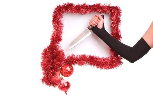 woman's hand with knife in the new-year frame on white background